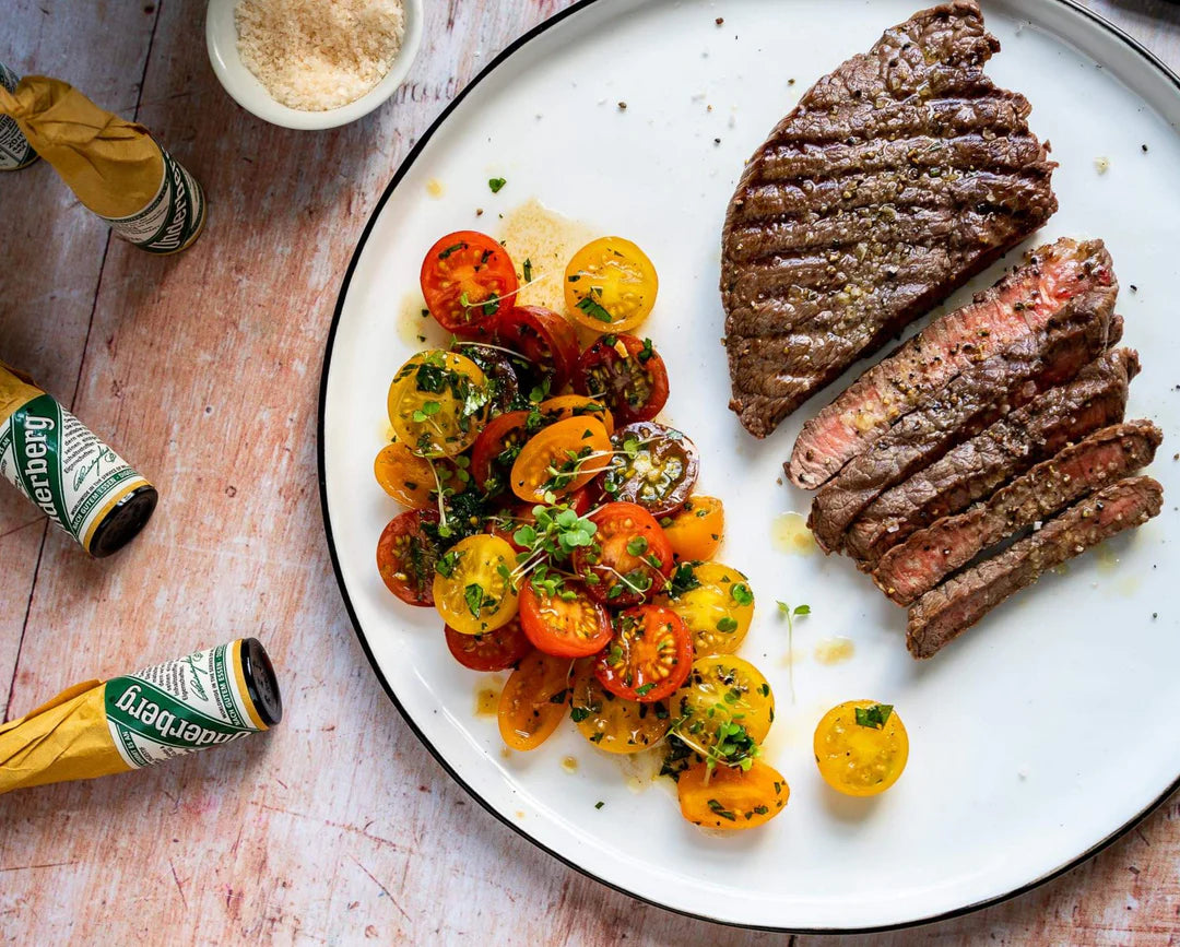 STEAK WITH HERB BUTTER, TOMATO SALAD AND BAGUETTE